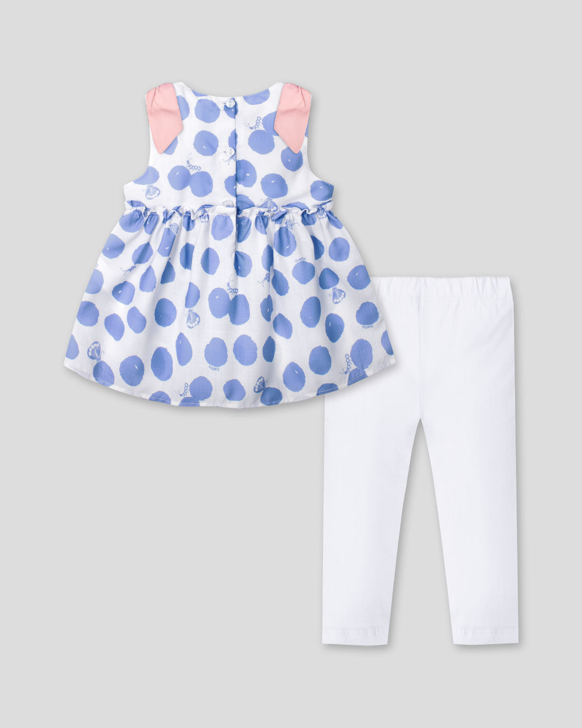 Conjunto blusa con estampado de lunares azules y leggins blanco para bebé niña