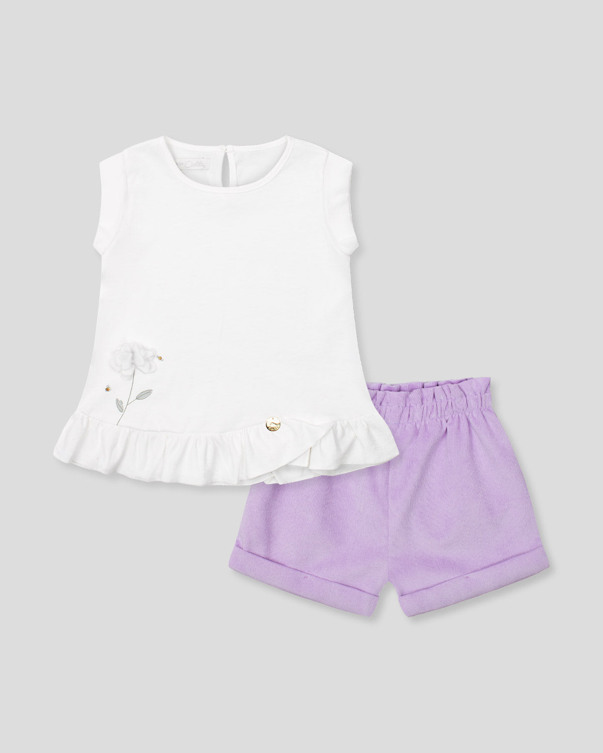 Conjunto blusa blanca sin mangas con aplique de flor y short lila para bebé niña