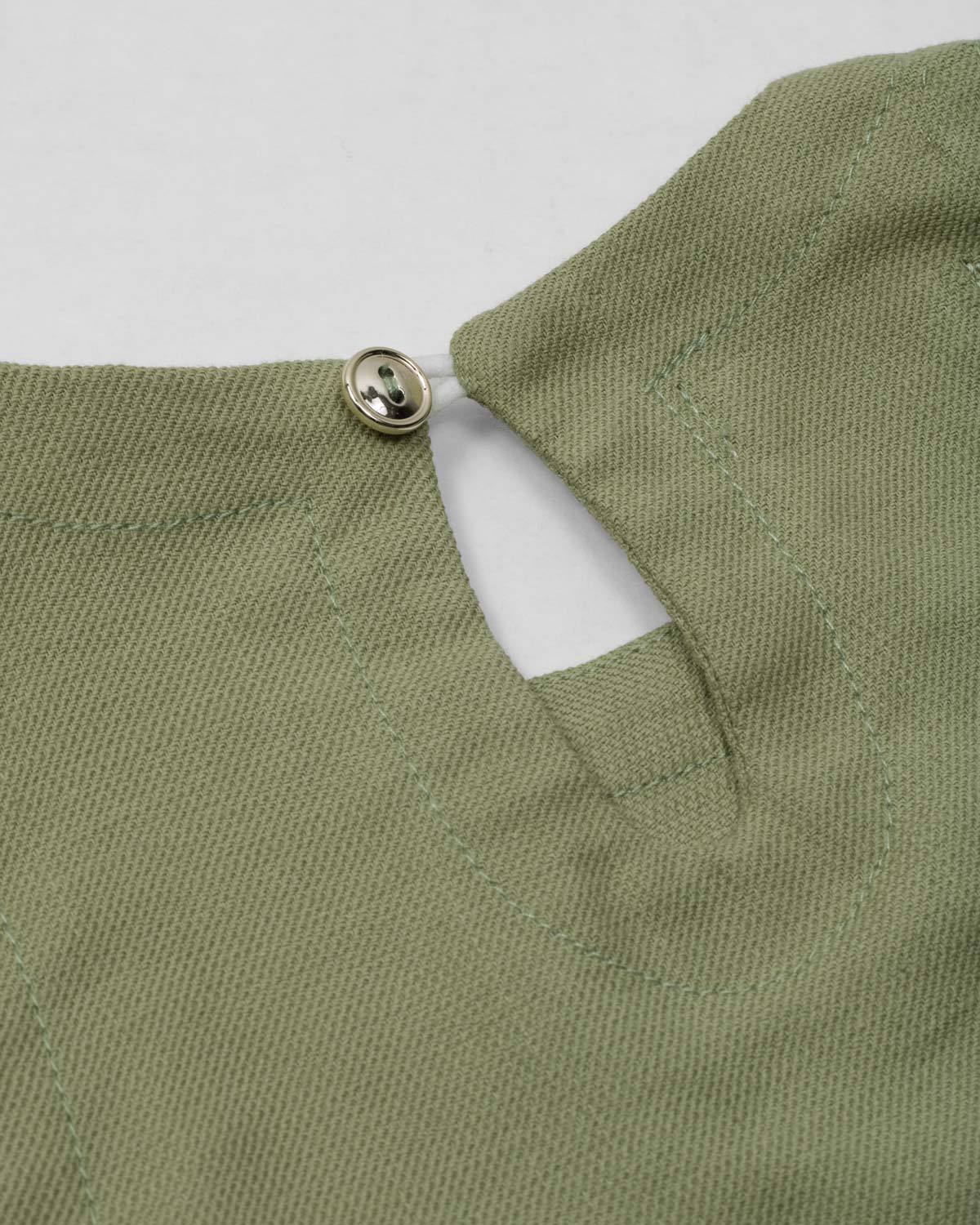 Conjunto blusa manga sisa verde con moñitos y short rosa para bebé niña