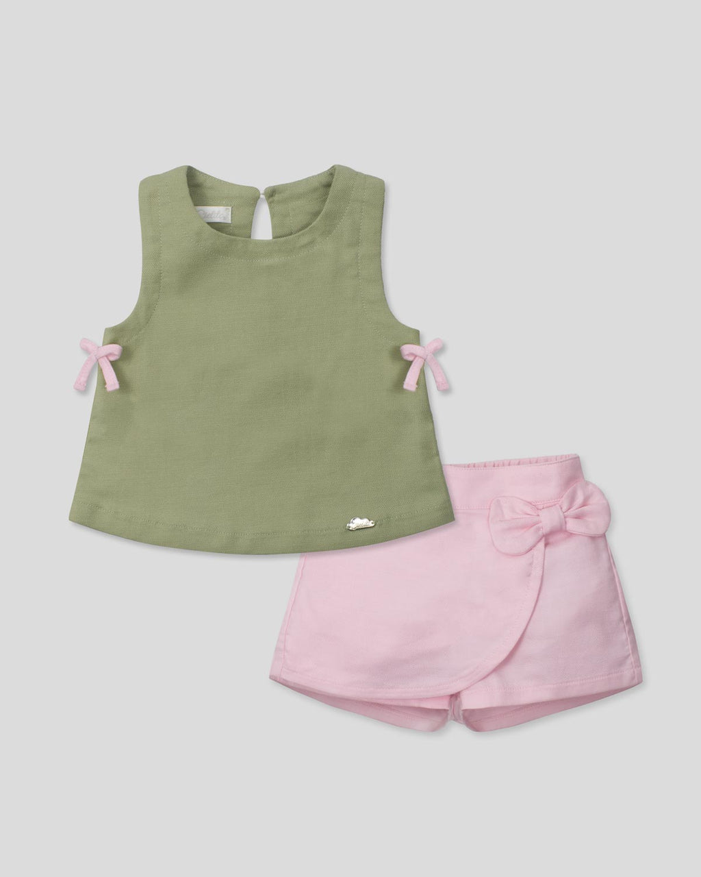 Conjunto blusa manga sisa verde con moñitos y short rosa para bebé niña