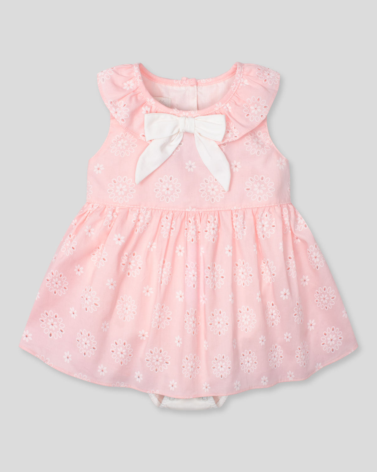 Vestido body rosa en tela hoja rota con estampado de flores y moño blanco para bebé niña