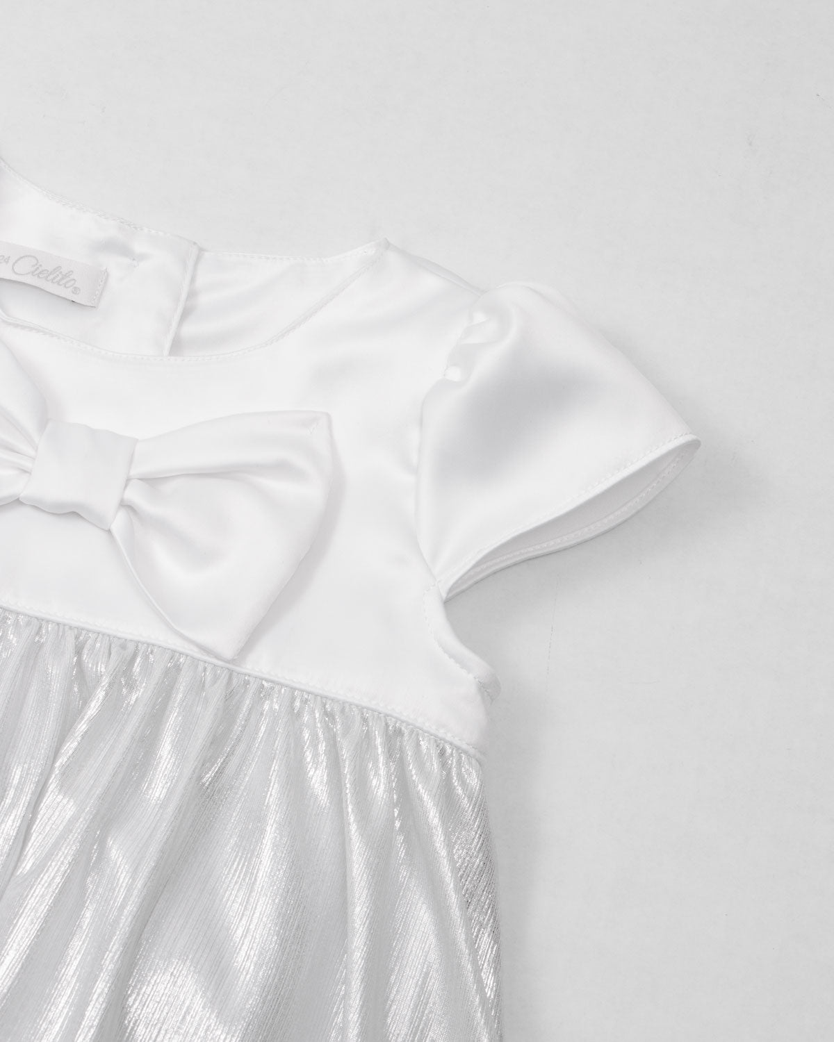 Vestido body con moño blanco satinado y plateado para bebé niña