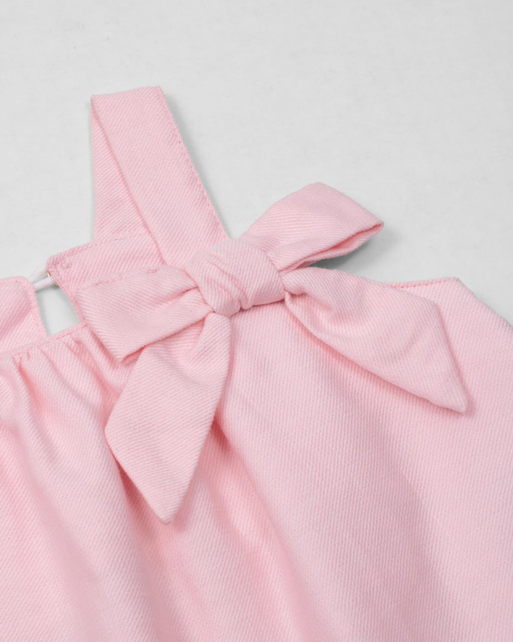 Vestido rosa de tiras con moñito para bebé niña