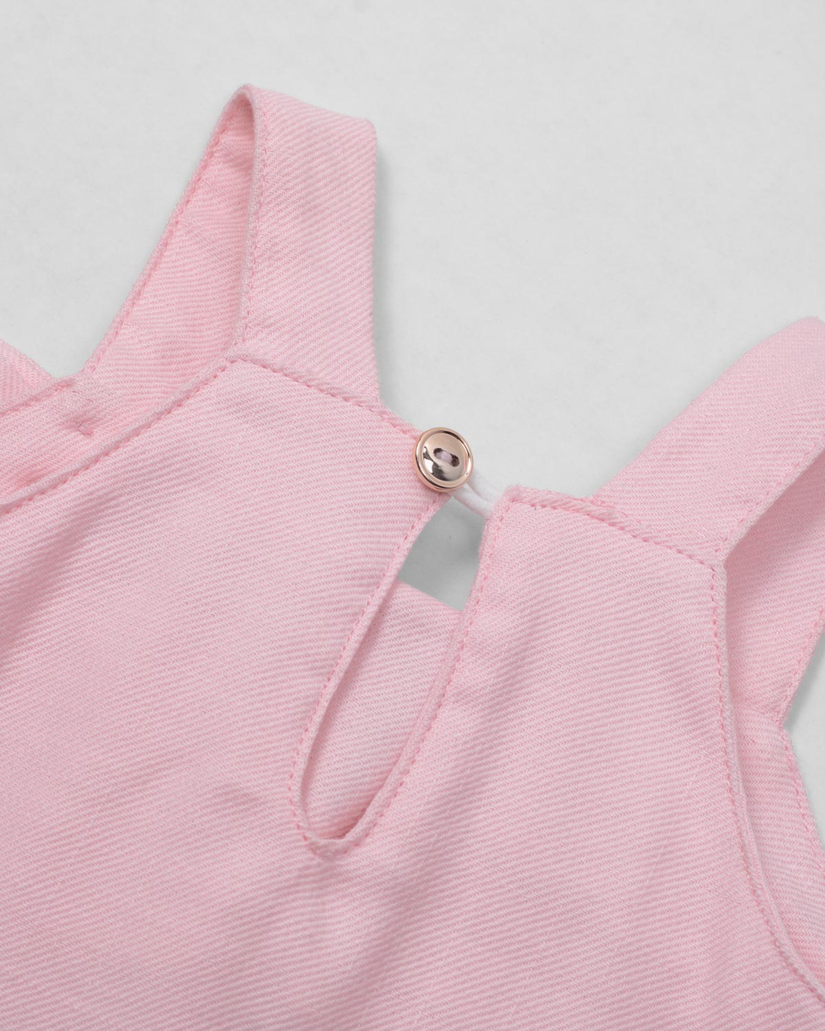 Vestido rosa de tiras con moñito para bebé niña