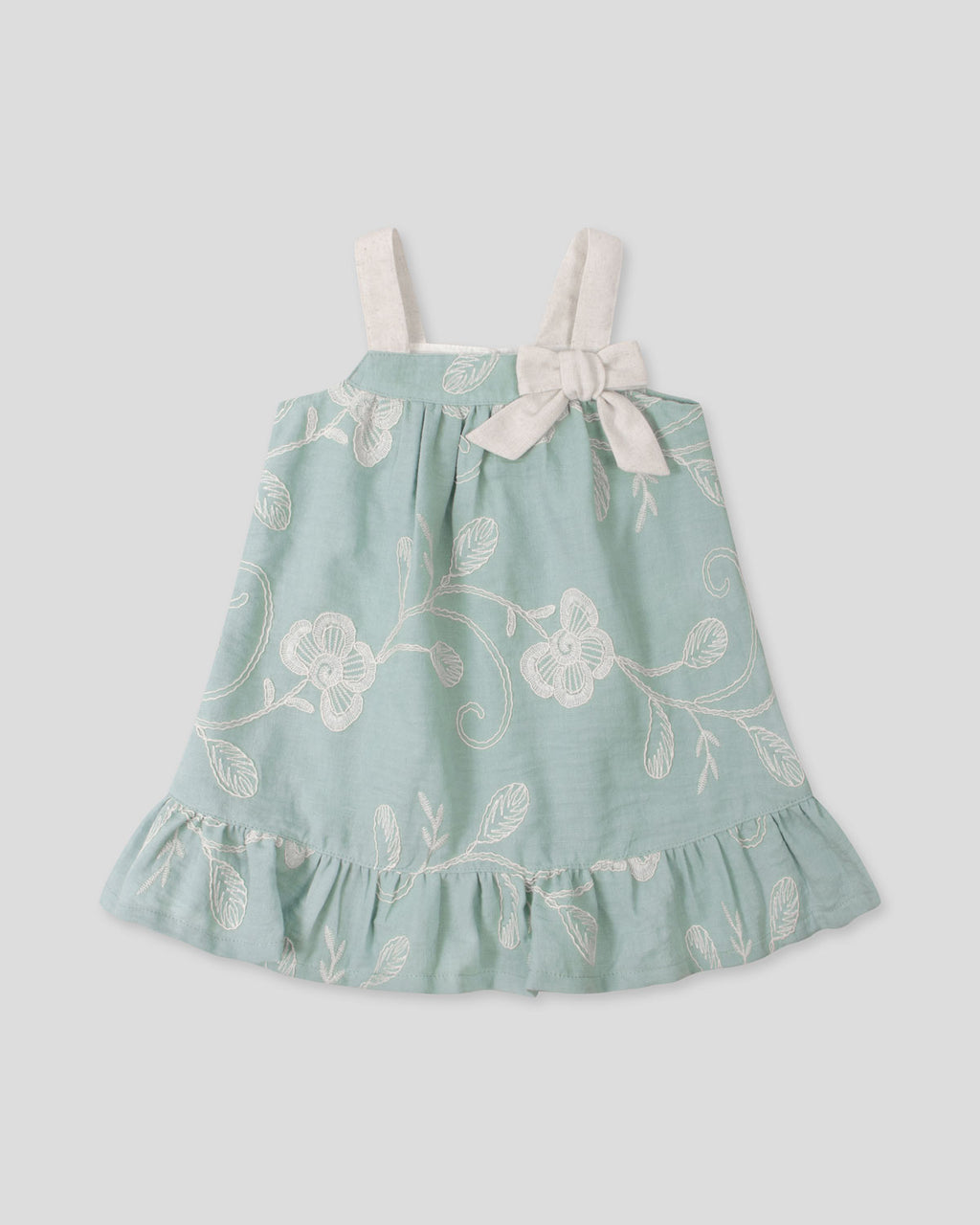 Vestido verde menta de tiras en tela bordada con moño para bebé niña