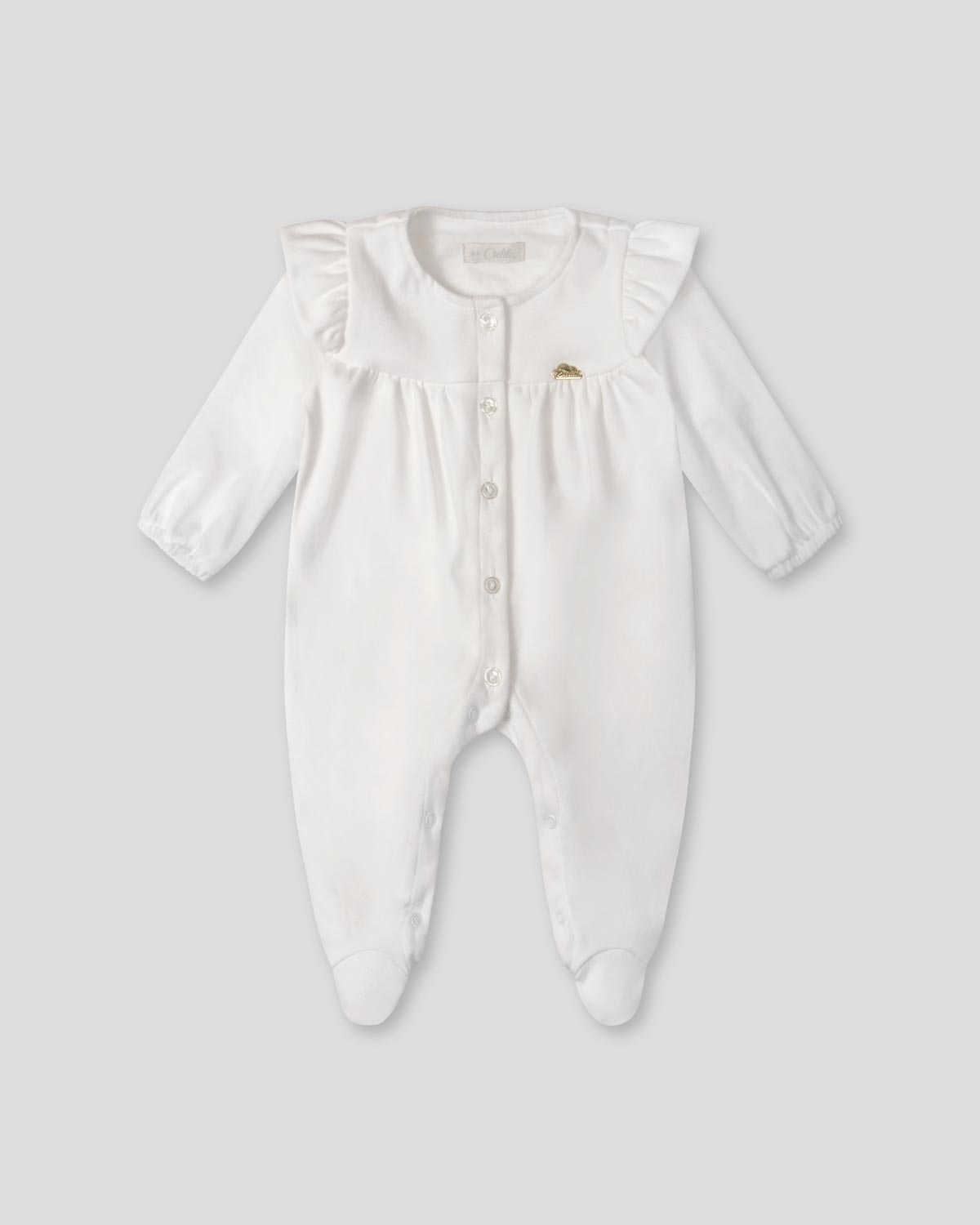 Pijama enteriza blanca con botones y boleros para recién nacida