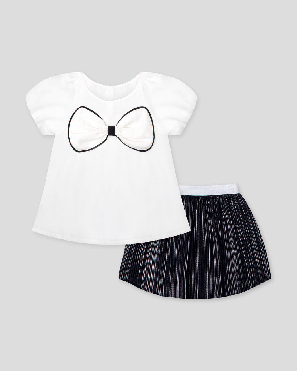 Conjunto blusa blanca con moño y falda negra plisada brillante para niña
