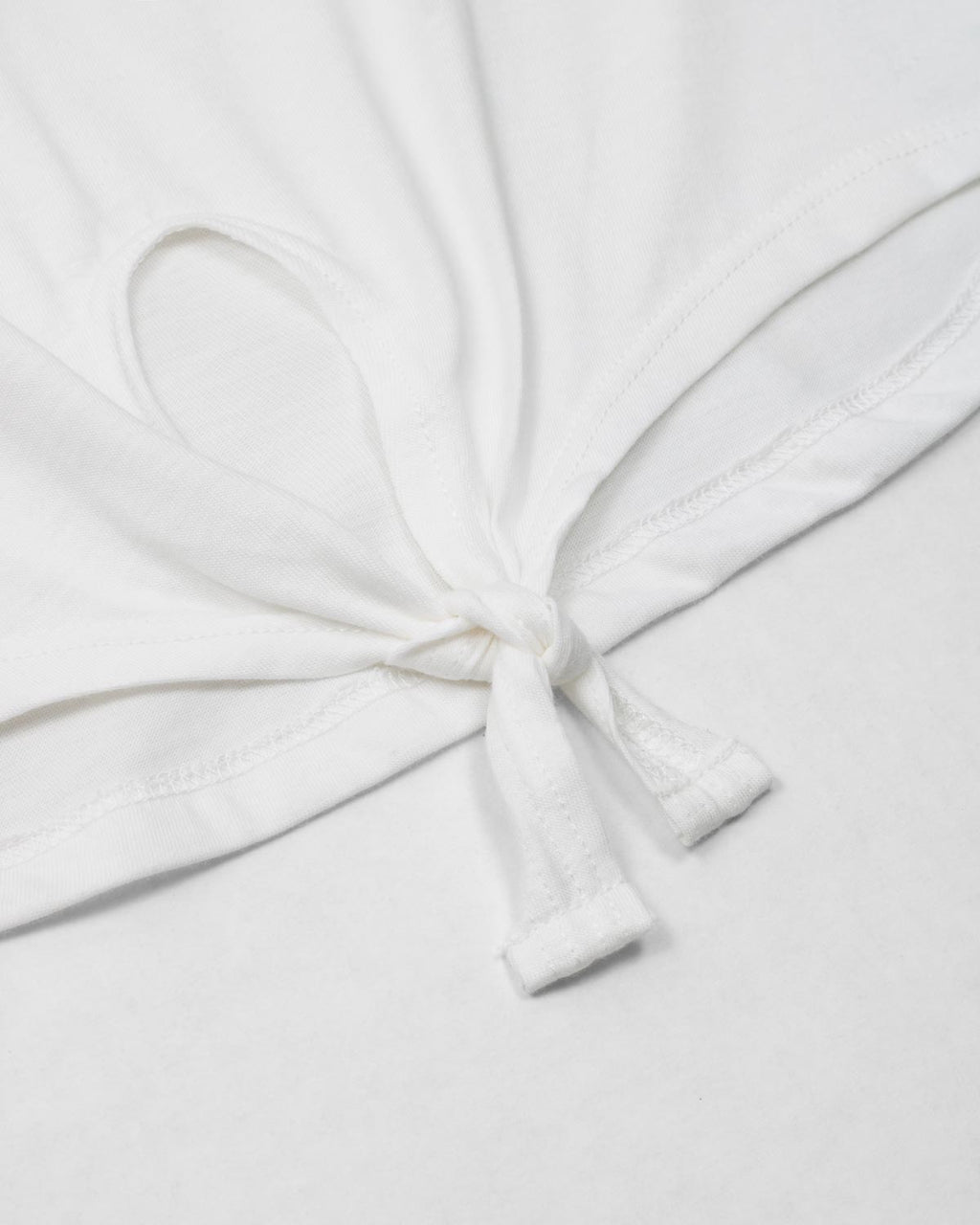 Camiseta amplia blanca con estampado de bolsito para niña