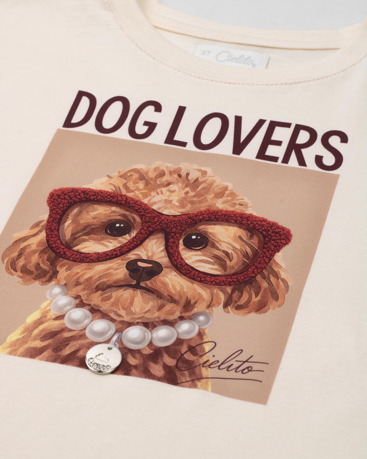 Camiseta crema con estampado para niña