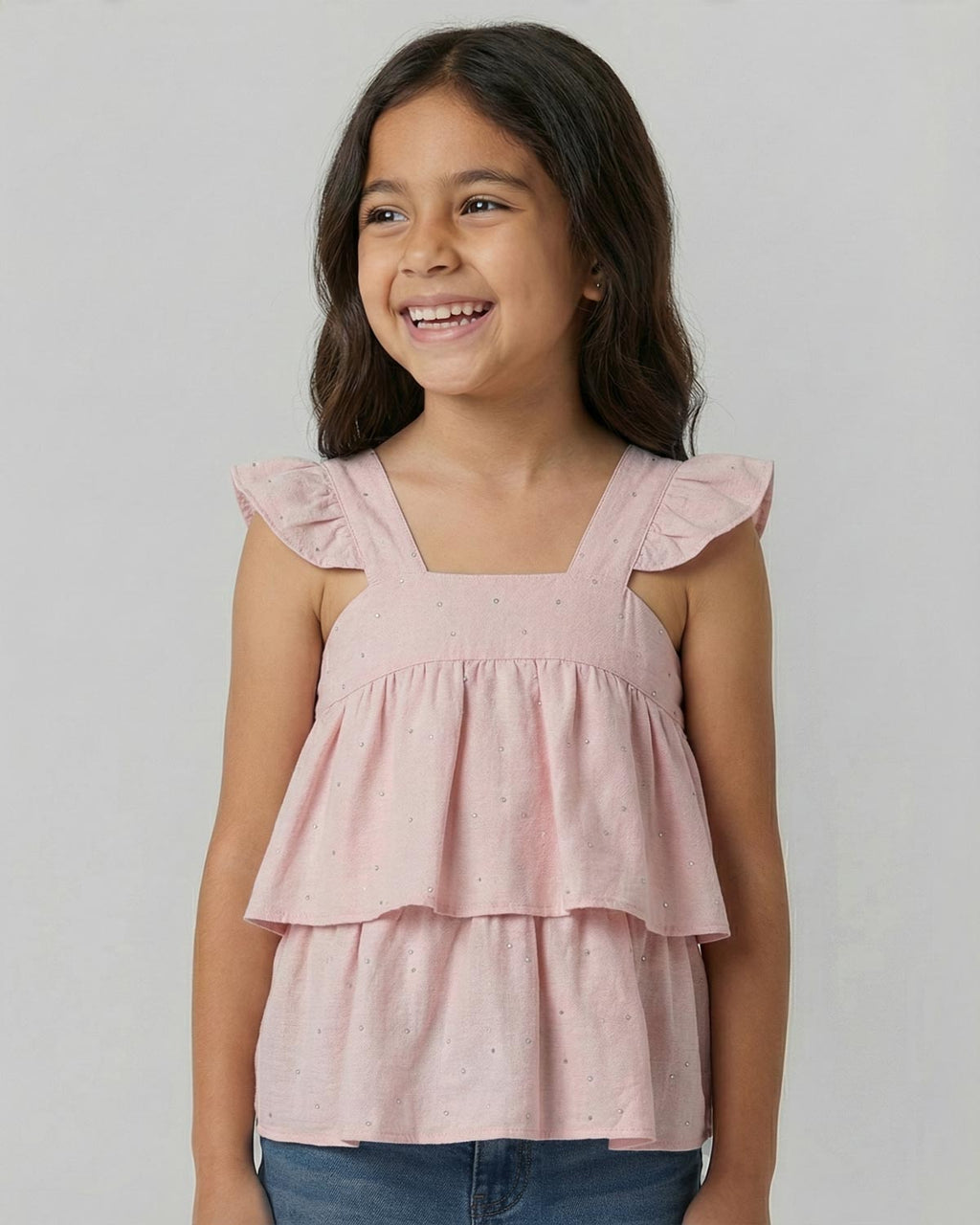Blusa rosa con brillos y tiras con boleritos para niña