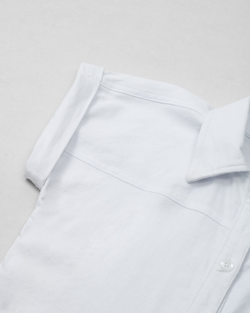 Camisa blanca de botones manga corta para niña