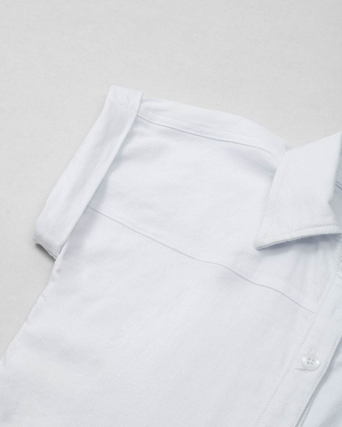 Camisa blanca de botones manga corta para niña
