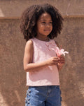 Blusa tela hoja rota rosa con moños para niña