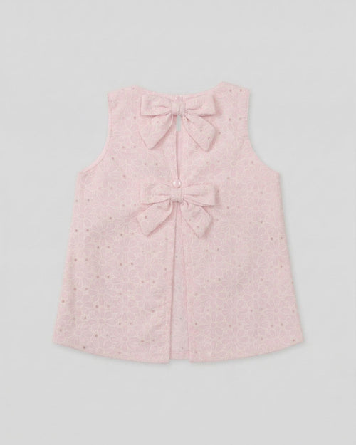 Blusa tela hoja rota rosa con moños para niña