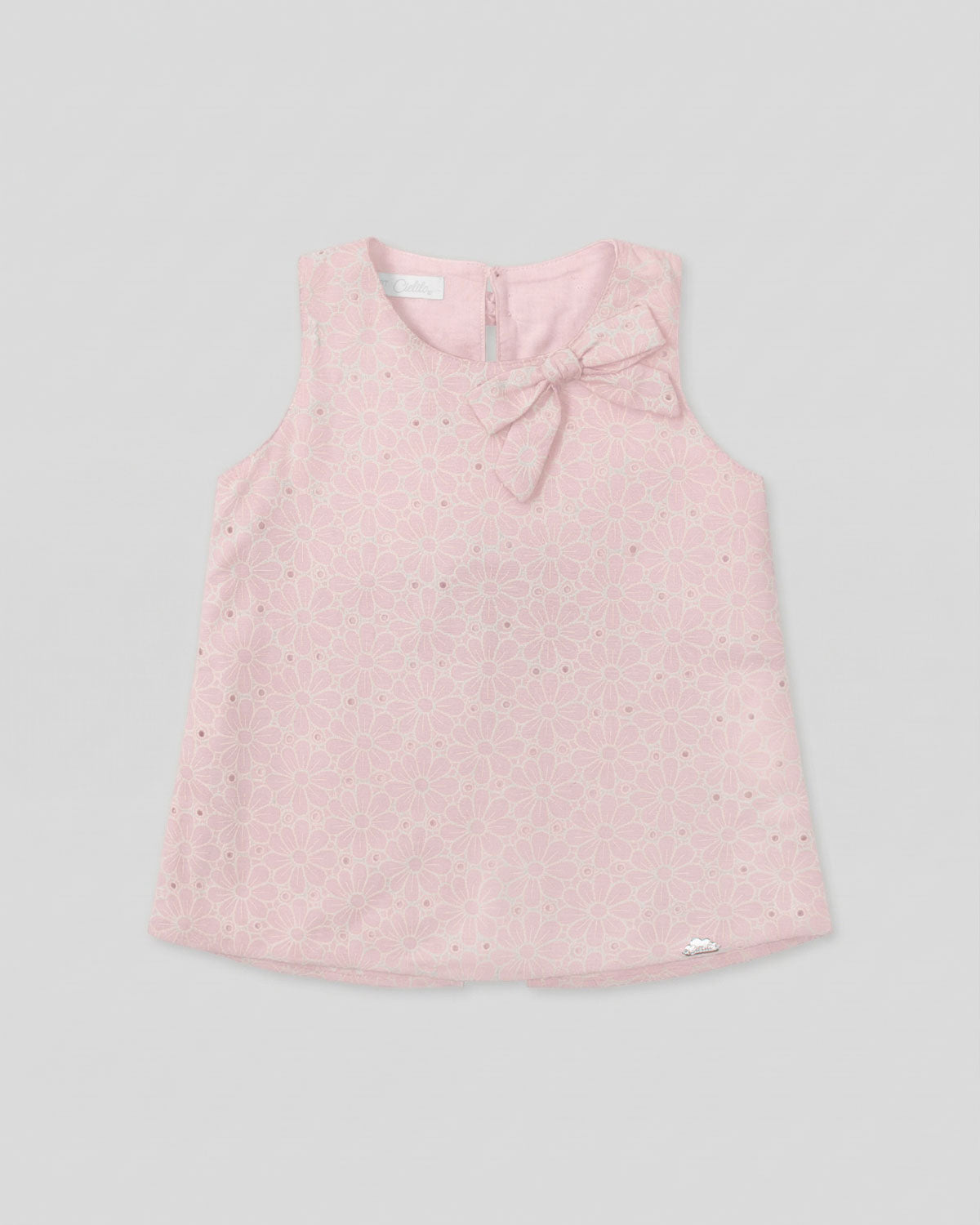 Blusa tela hoja rota rosa con moños para niña