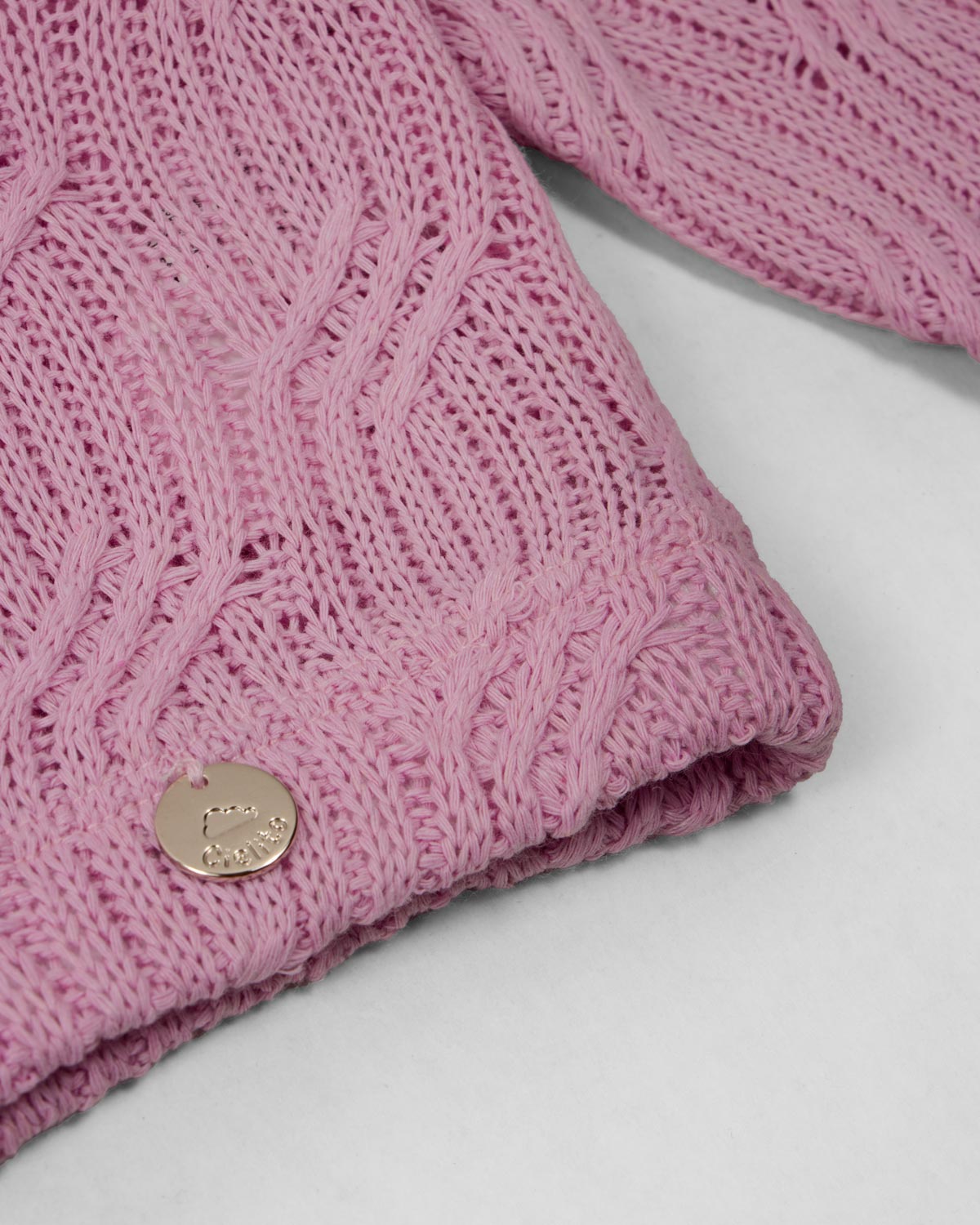 Saco en tejido trenzado rosa para niña