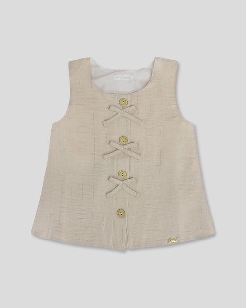 Blusa  beige con botones y moñitos para niña