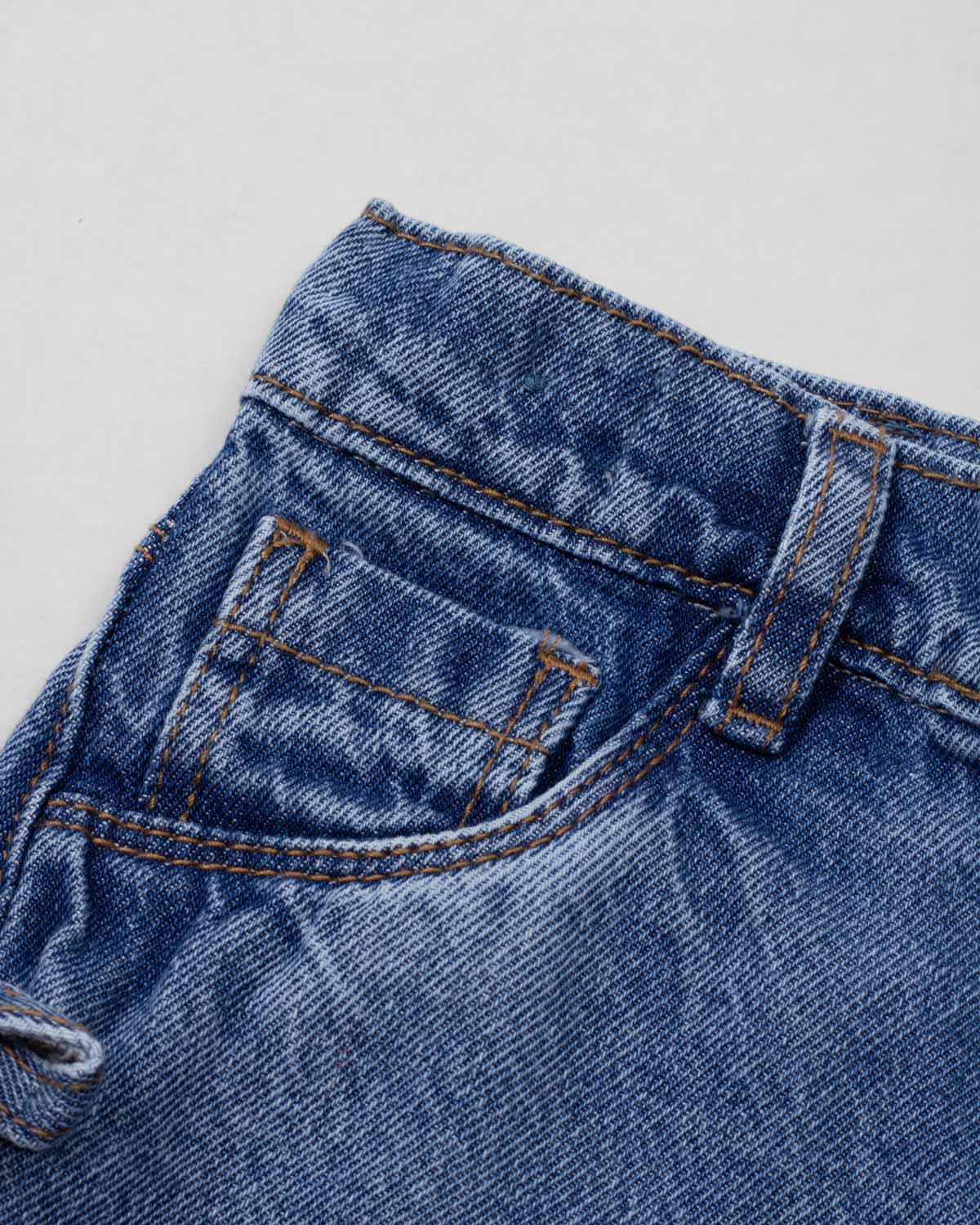 Short denim con moñitos en costados para niña