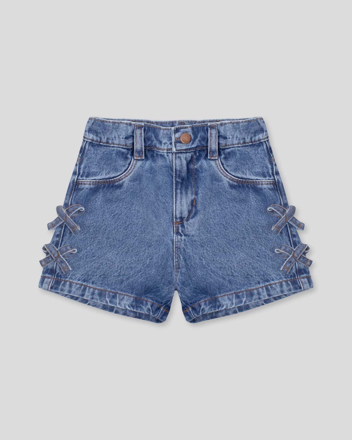Short denim con moñitos en costados para niña