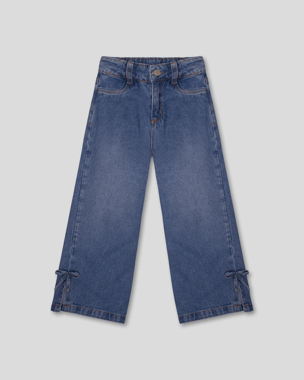 Jean denim marine fit con detalle de moños en la bota para niña