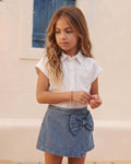 Falda short denim con moño para niña