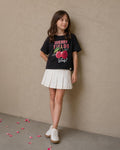 Falda short cruda con pliegues para niña