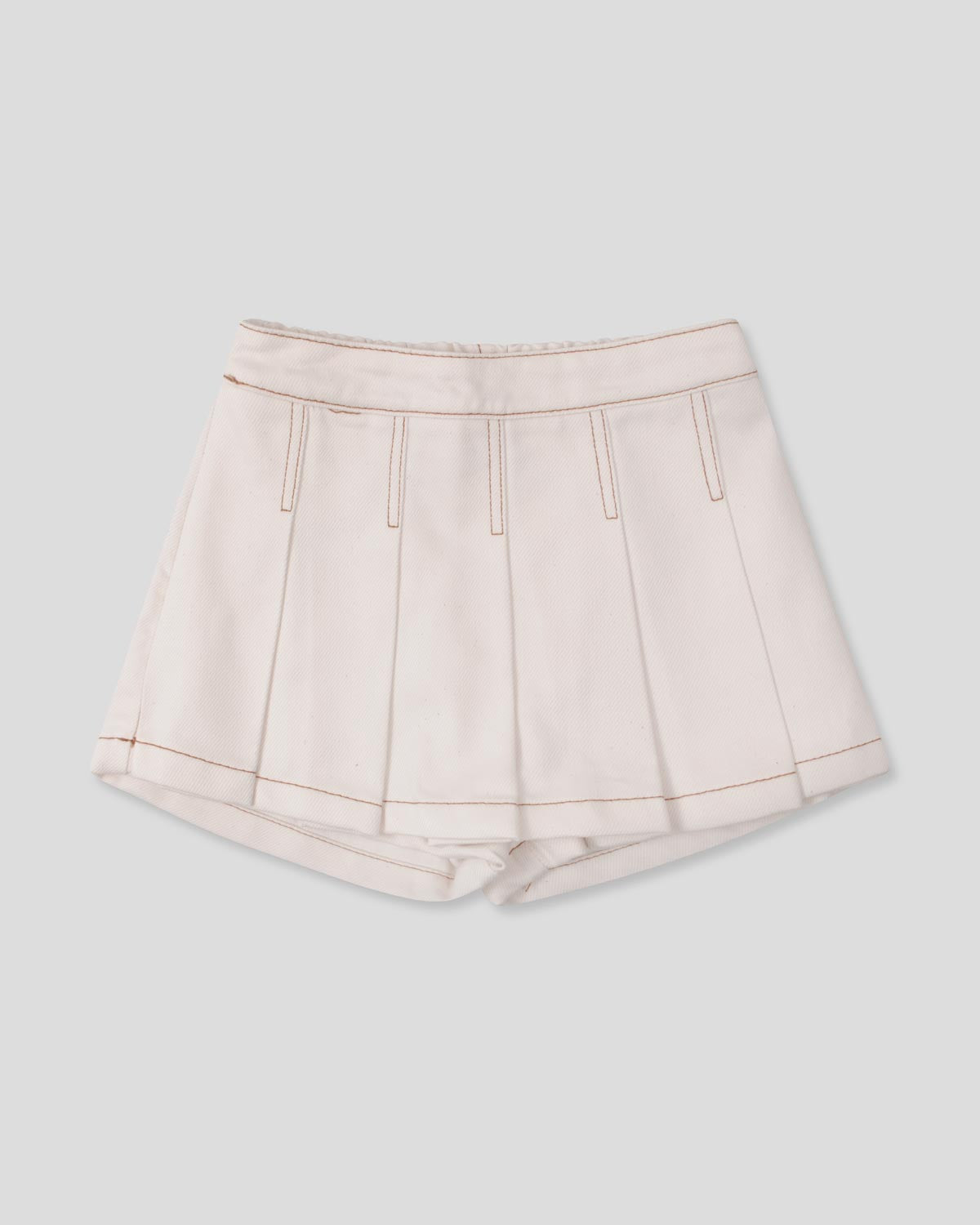 Falda short cruda con pliegues para niña