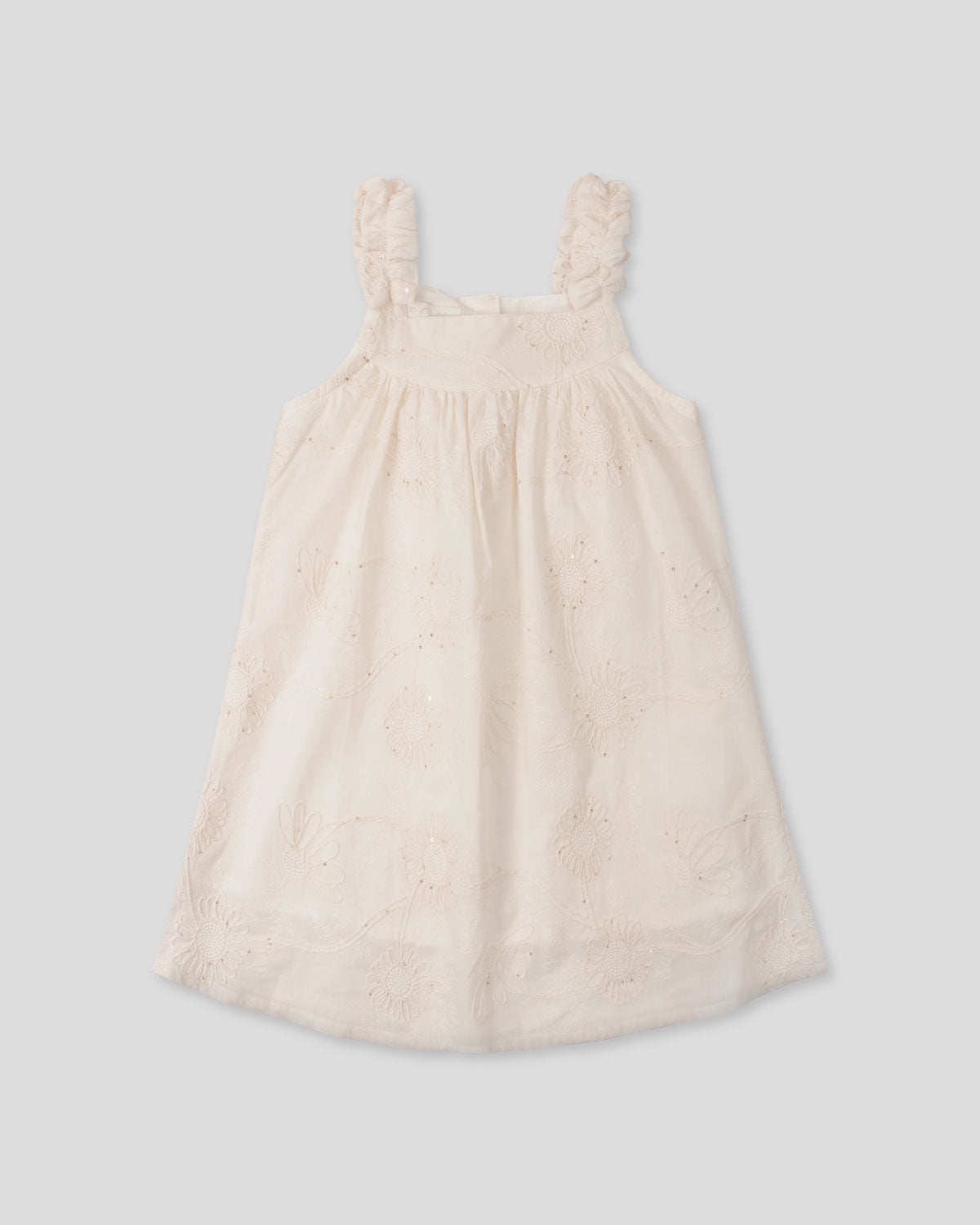 Vestido crema de tiras zurcidas con tela con bordado de flores y lentejuelas para niña