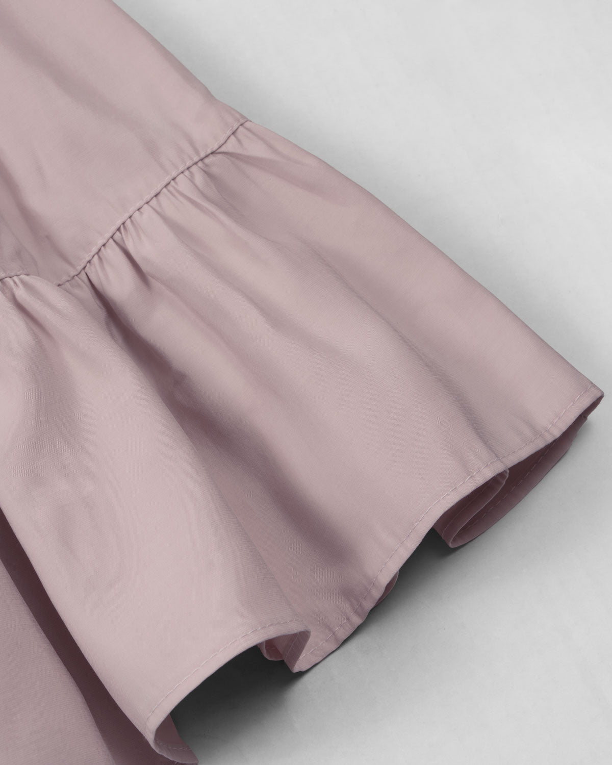 Vestido rosa de tiras con boleros y apliques de flor para niña