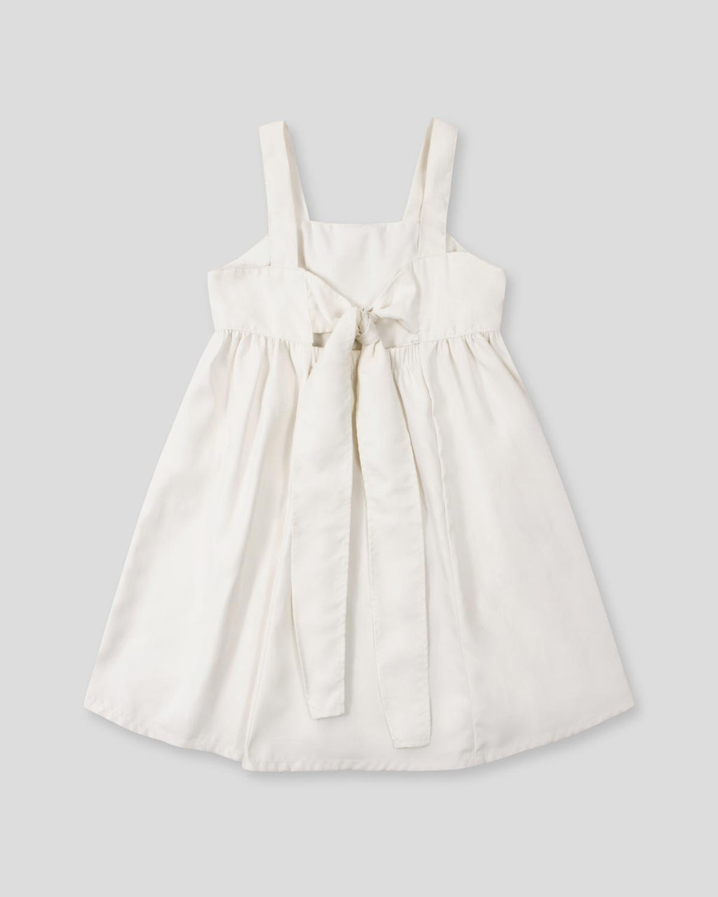 Vestido de tiras con textura tejida y lazos en espalda para niña