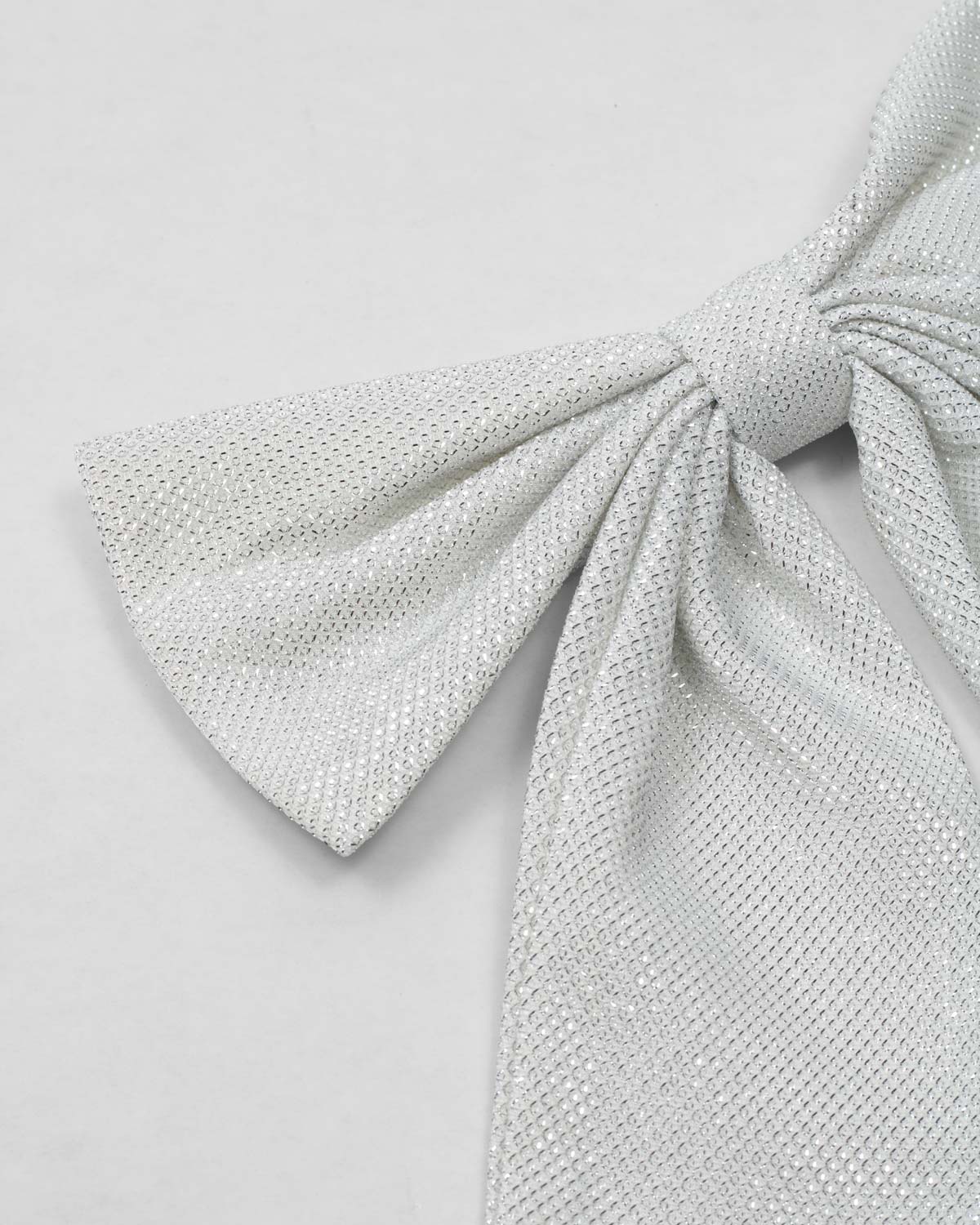 Moño pinza plateado para niña