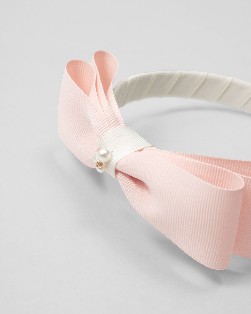 Diadema con moño rosa para niña