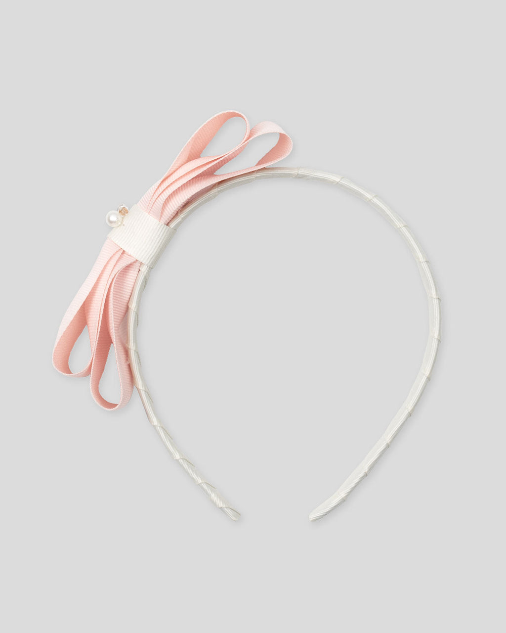 Diadema con moño rosa para niña