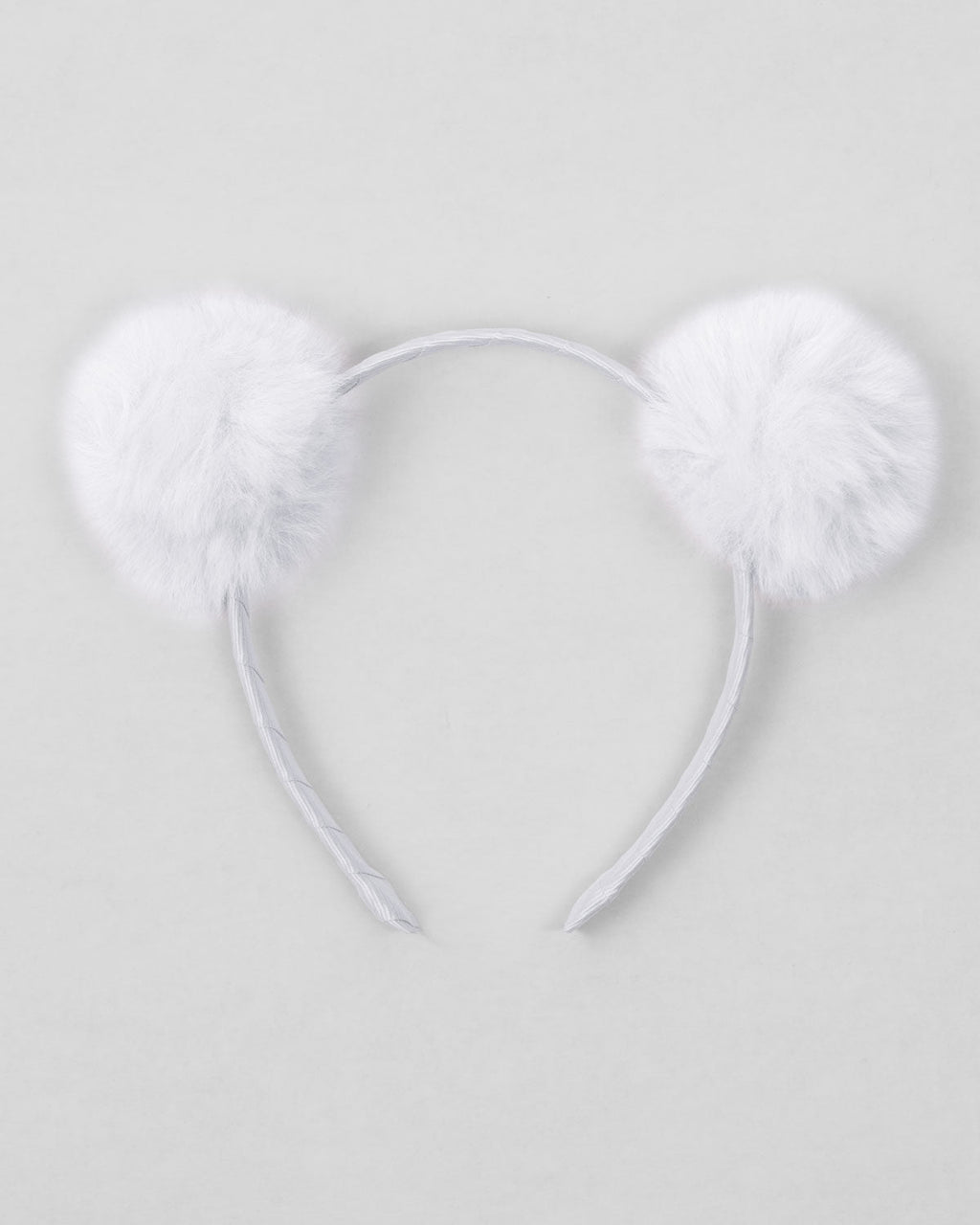 Diadema blanca con pompones para niña