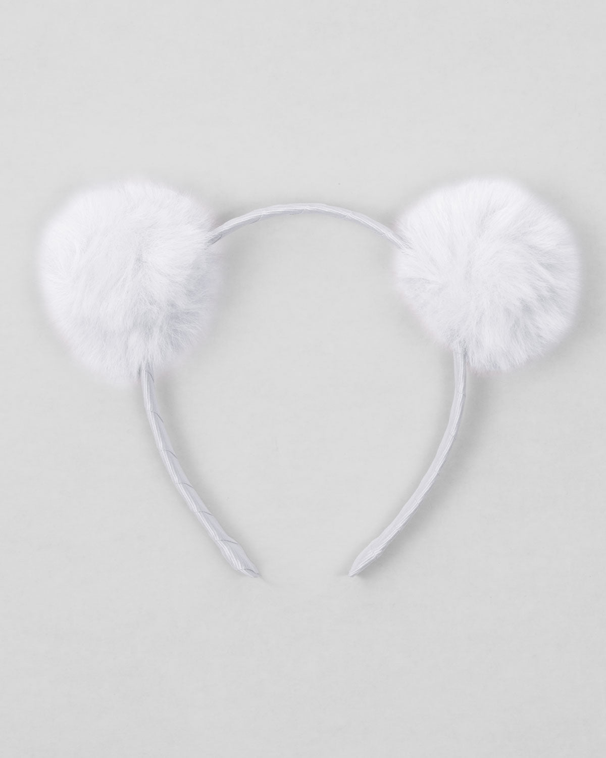 Diadema blanca con pompones para niña