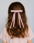 Moño pinza de cintas rosa