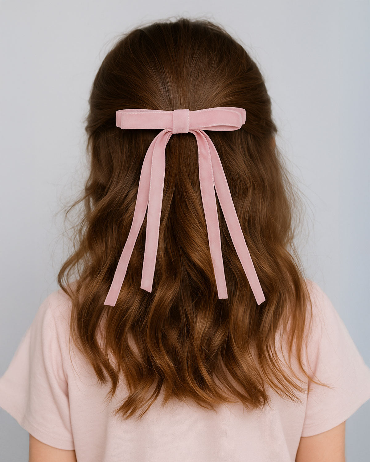 Moño pinza de cintas rosa