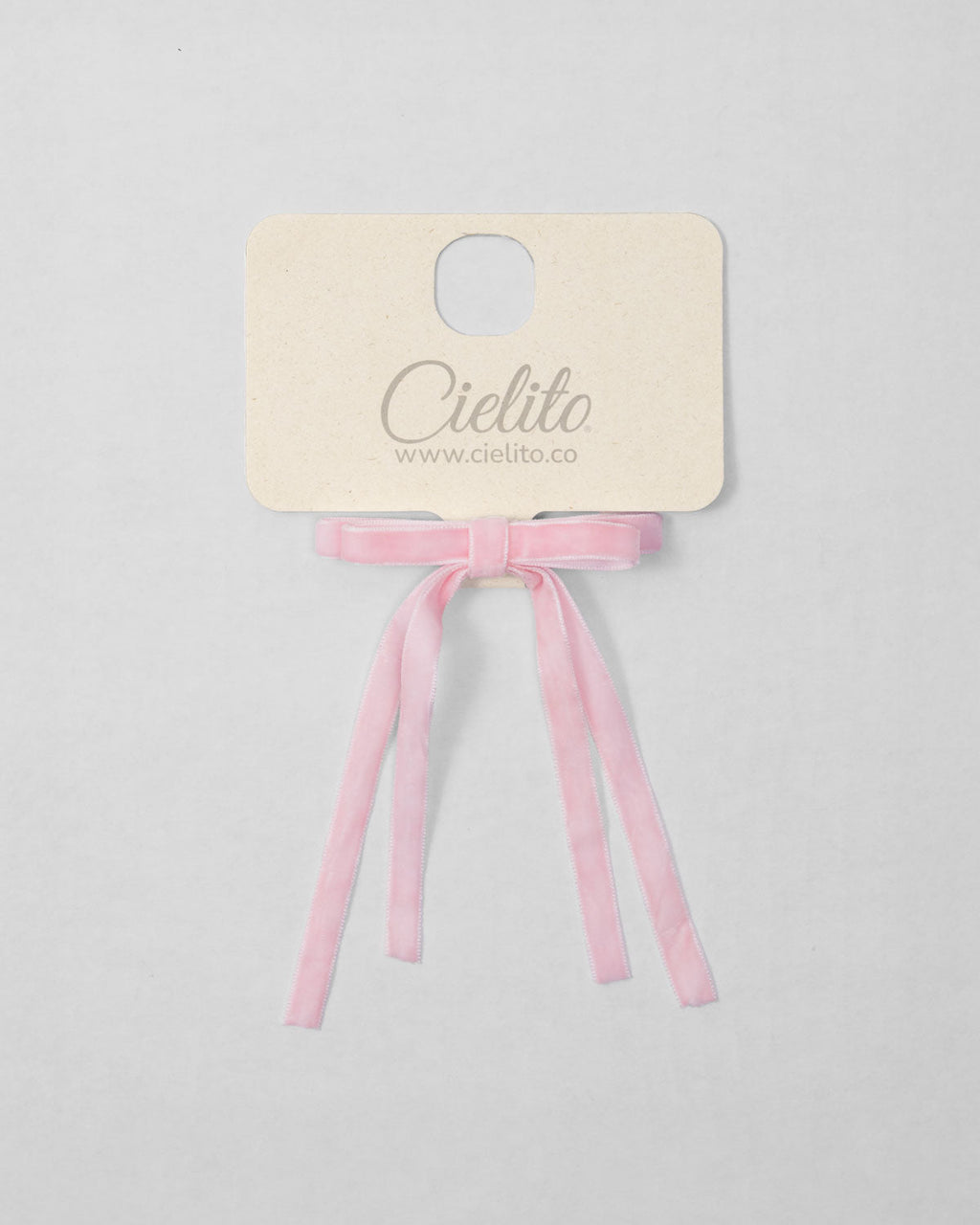 Moño pinza de cintas rosa