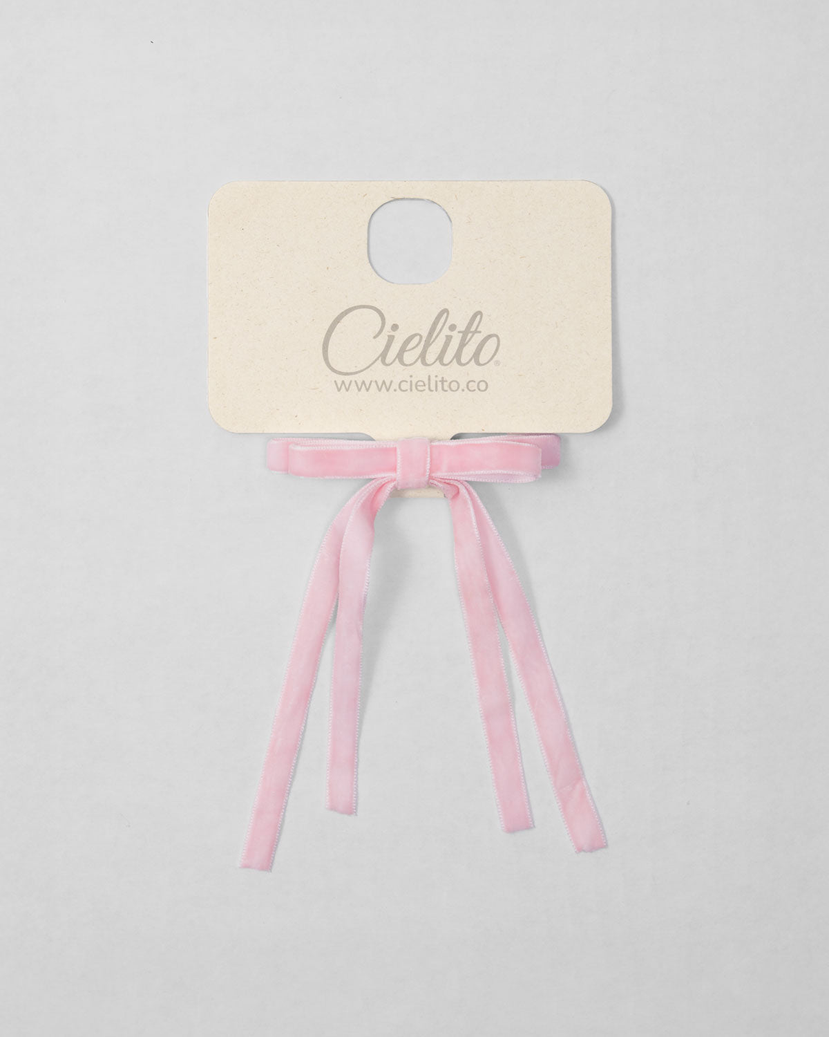 Moño pinza de cintas rosa