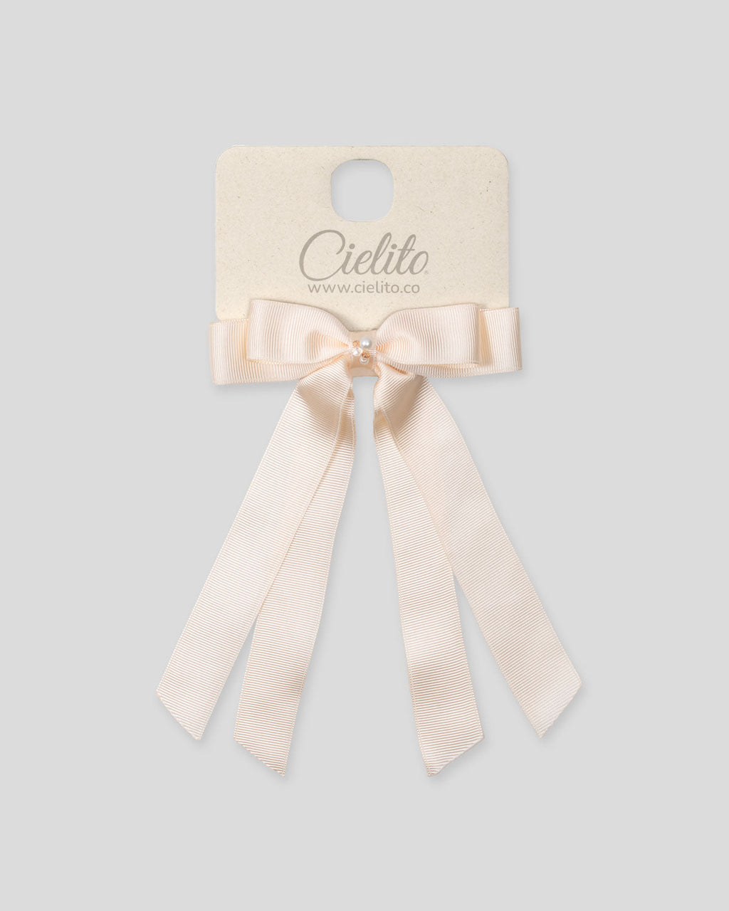Moño pinza de cintas satinadas blanco crema