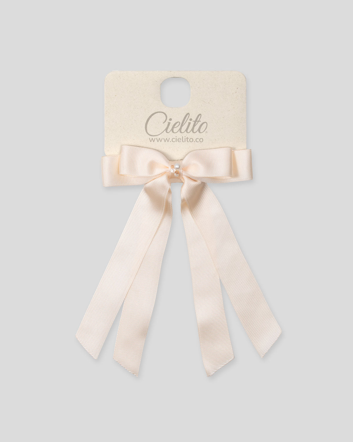 Moño pinza de cintas satinadas blanco crema