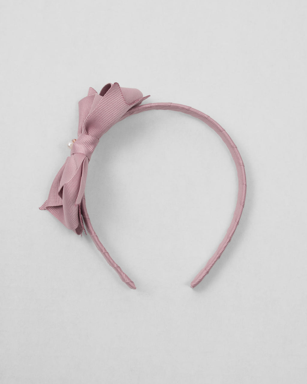 Diadema palo de rosa con moñito para niña