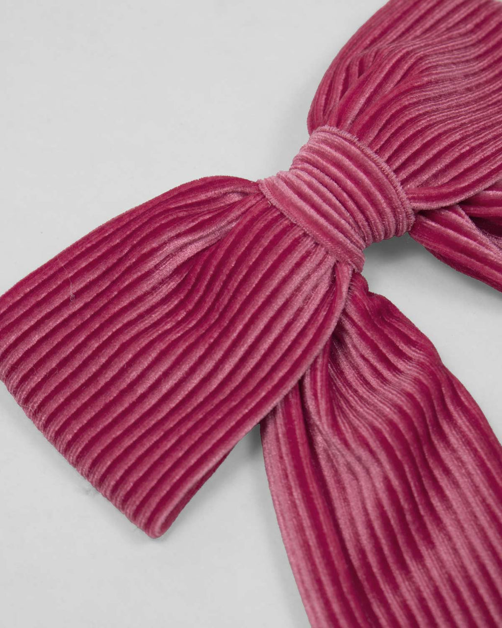 Moño pinza fucsia en tejido rib para niña