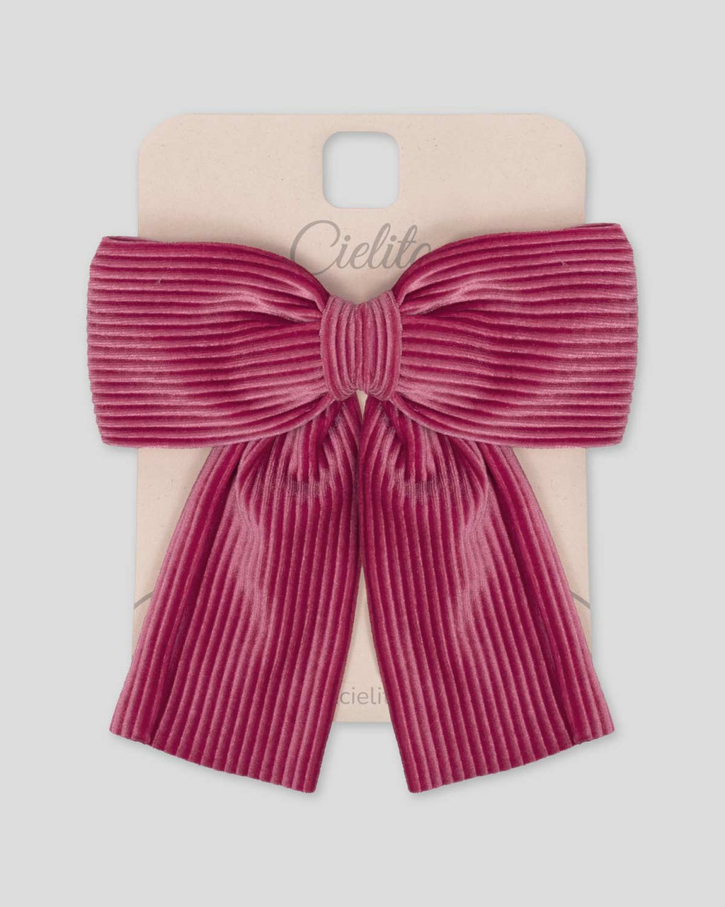 Moño pinza fucsia en tejido rib para niña